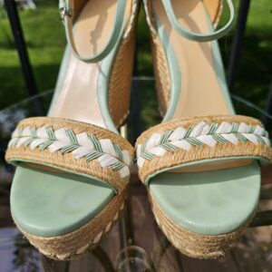 Mint green leather footbeds of the Gucci espadrille wedge sandals shown for condition