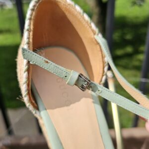 Silver-tone buckle on the mint green leather ankle strap of the Gucci espadrille wedge sandal