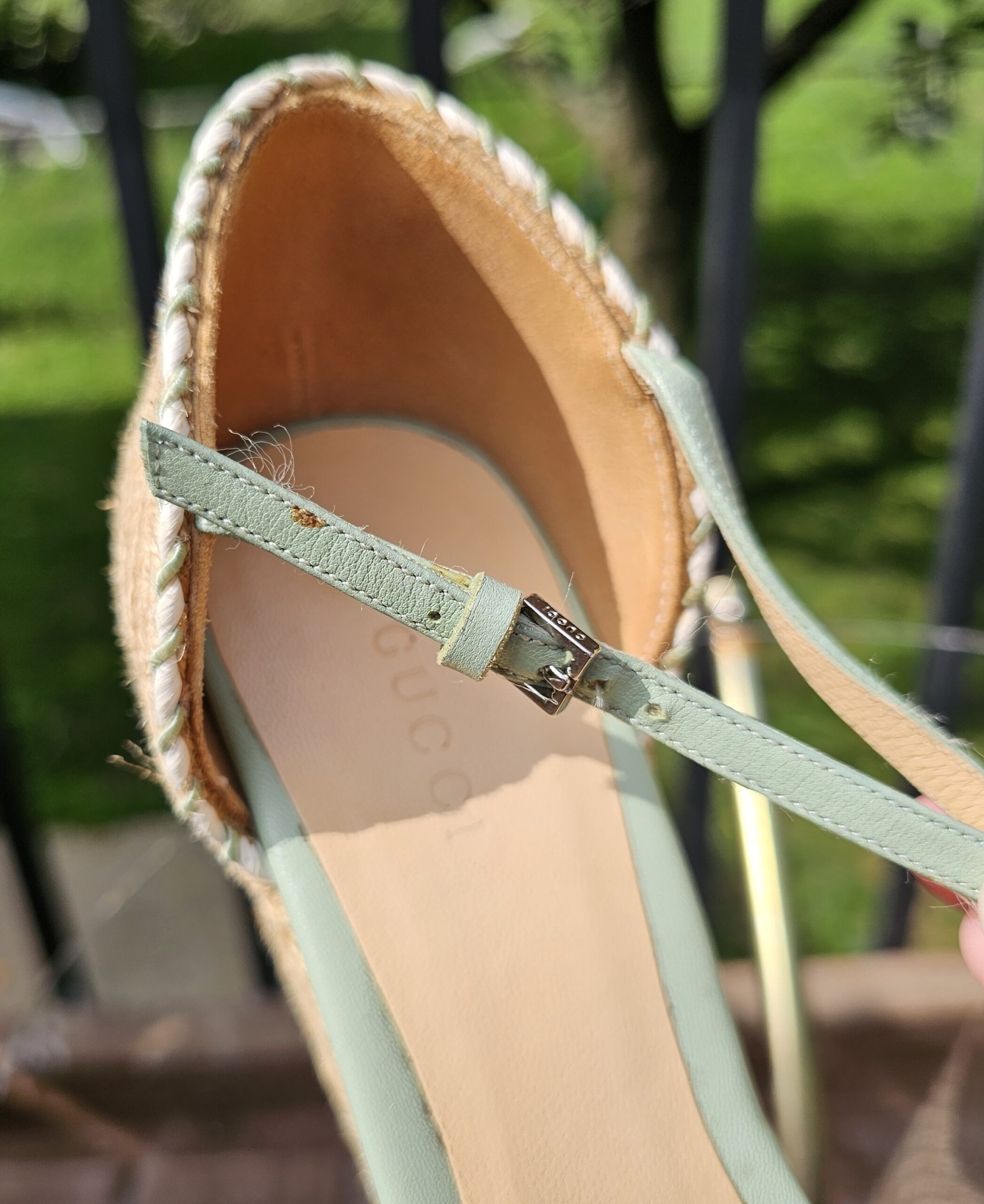 Silver-tone buckle on the mint green leather ankle strap of the Gucci espadrille wedge sandal