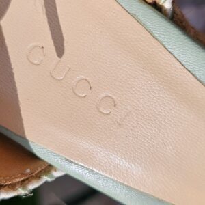 GUCCI embossed on the leather insole of the mint green espadrille wedge sandals