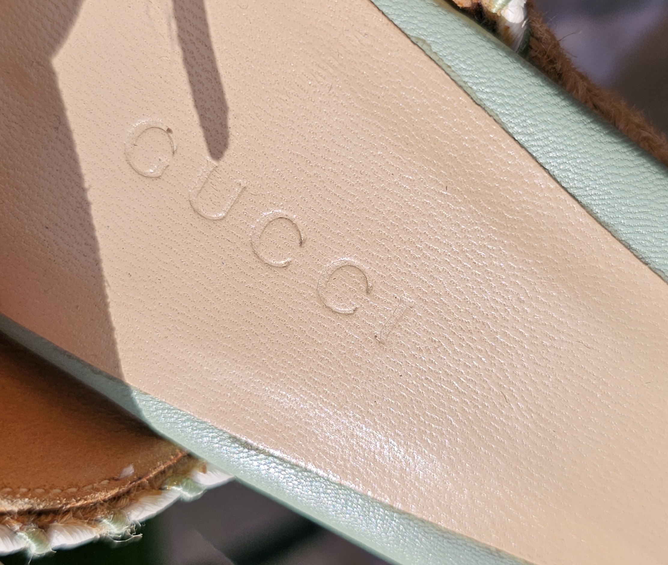GUCCI embossed on the leather insole of the mint green espadrille wedge sandals