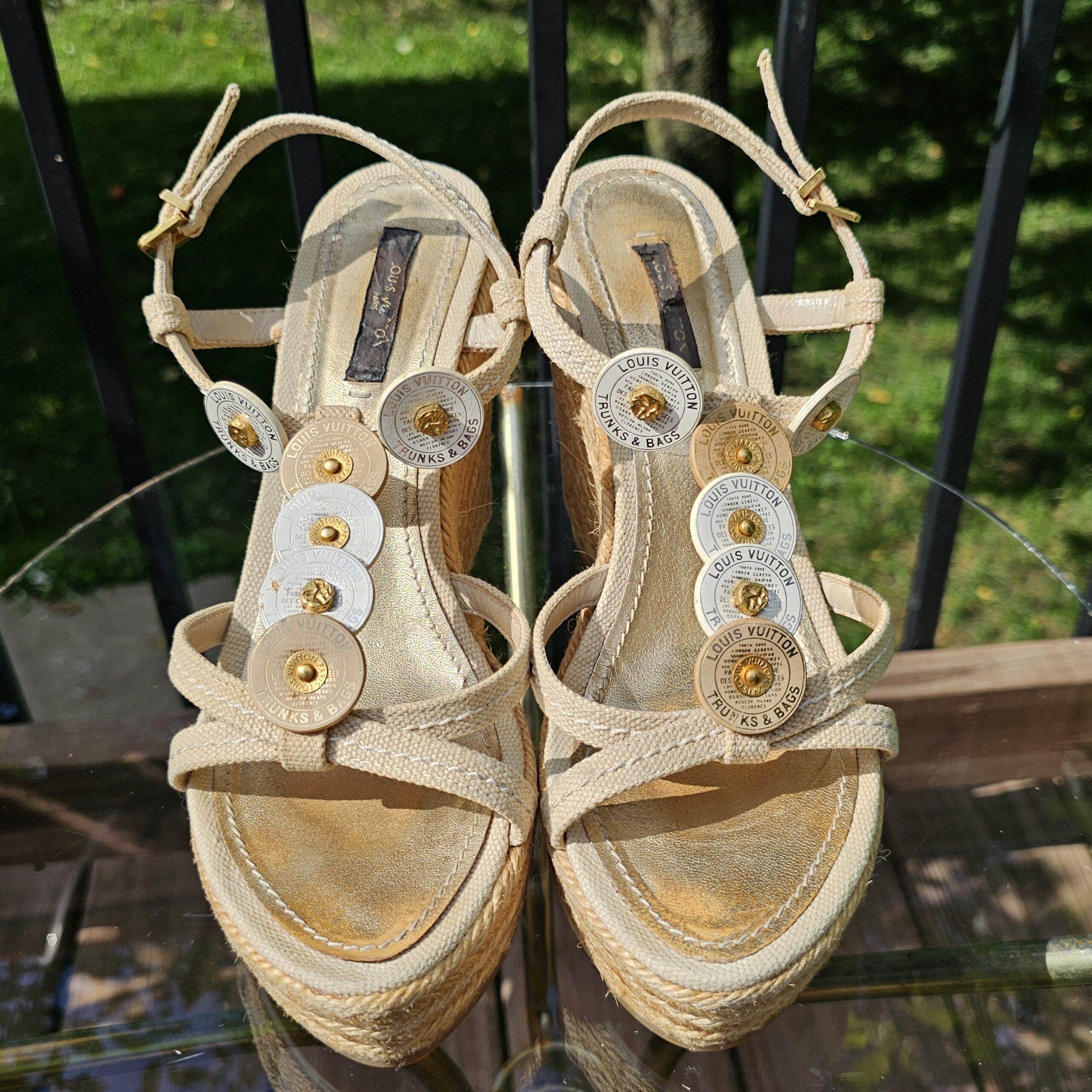 Top view of both Louis Vuitton Trunks and Bags espadrille wedge sandals showing the strappy uppers and discs
