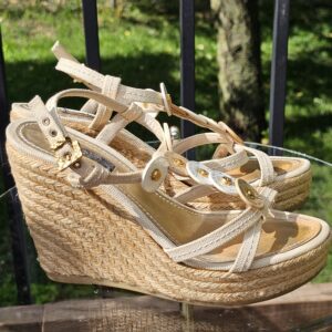 Side profile of the Louis Vuitton Trunks and Bags espadrille wedge sandal showing the woven jute wedge
