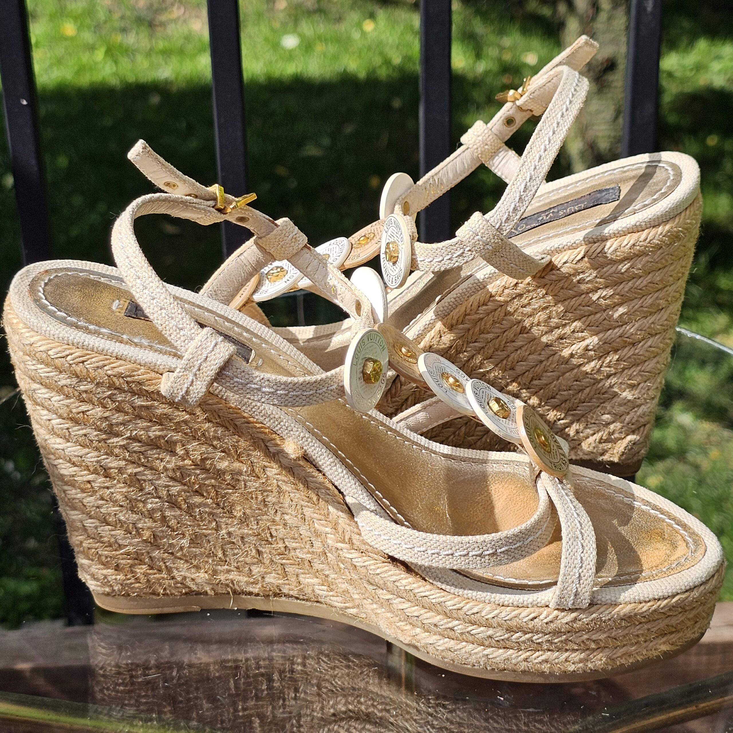 Angled view of the Louis Vuitton Trunks and Bags espadrille wedge sandals showing the straps and footbed