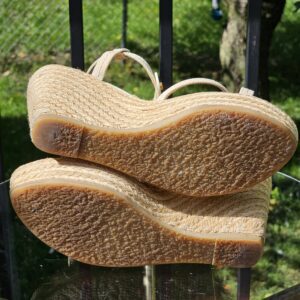 Soles of the Louis Vuitton Trunks and Bags espadrille wedge sandals shown for wear
