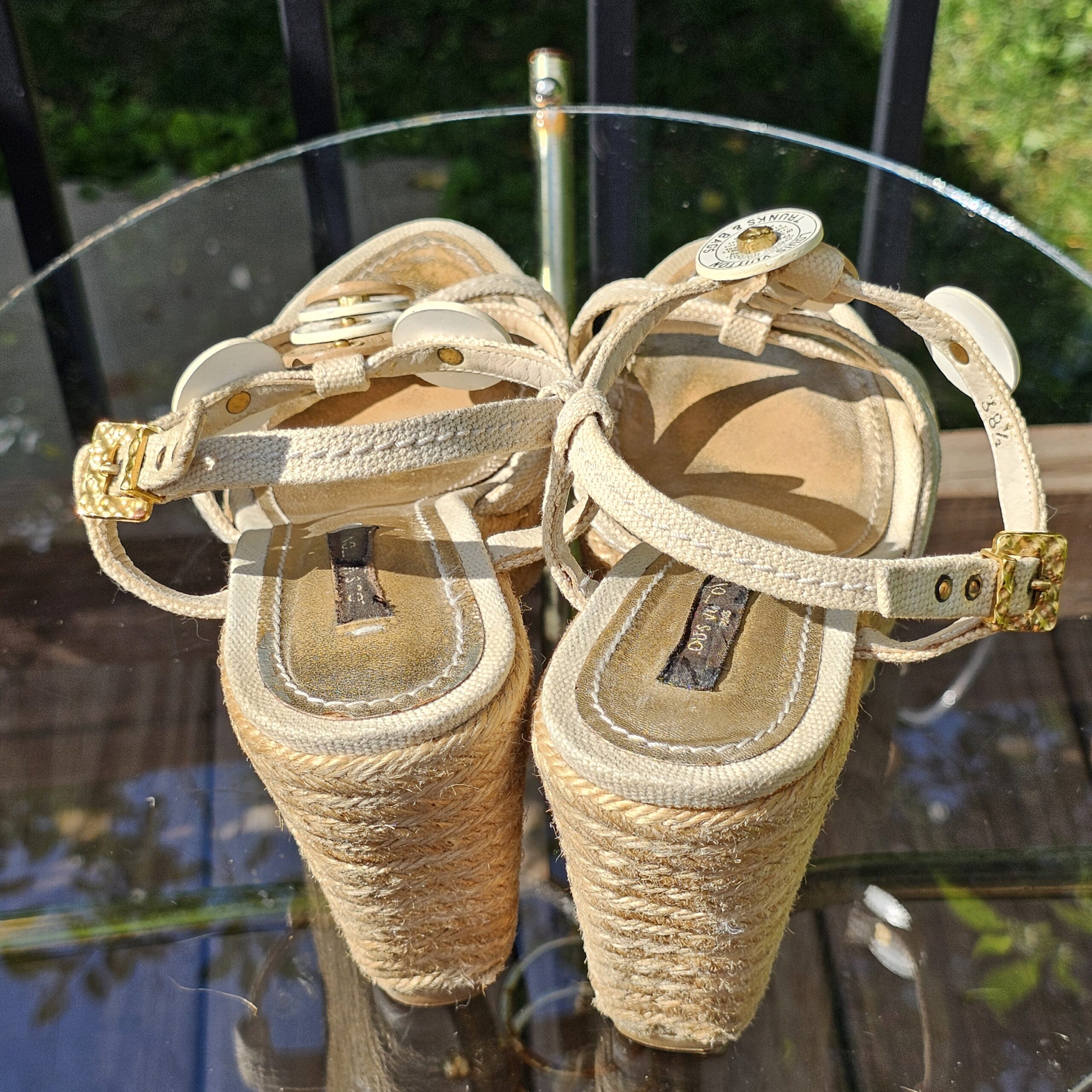 Pair of Louis Vuitton Trunks and Bags espadrille wedge sandals shown from the back and side