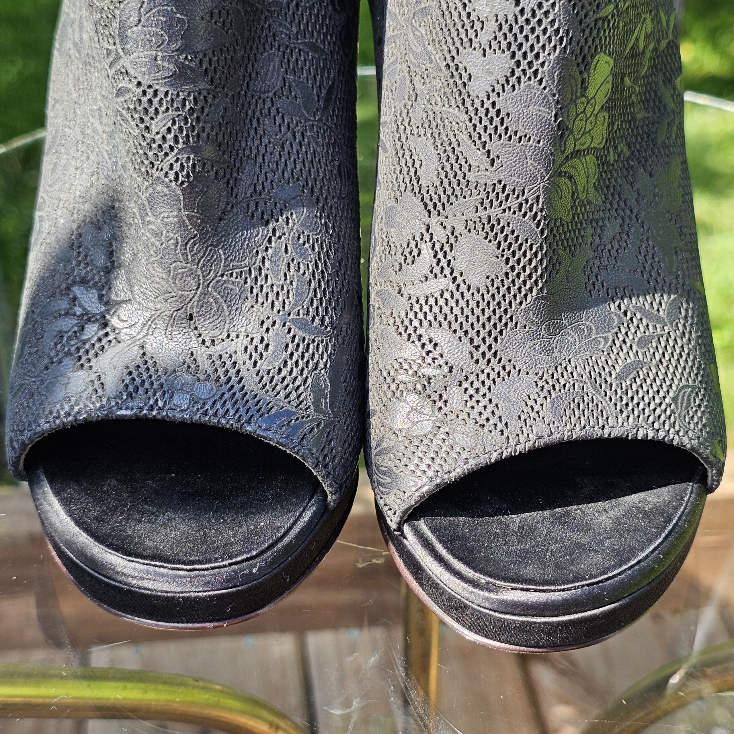 Close-up of the peep toe openings and cap toe on the Chanel lace ankle booties