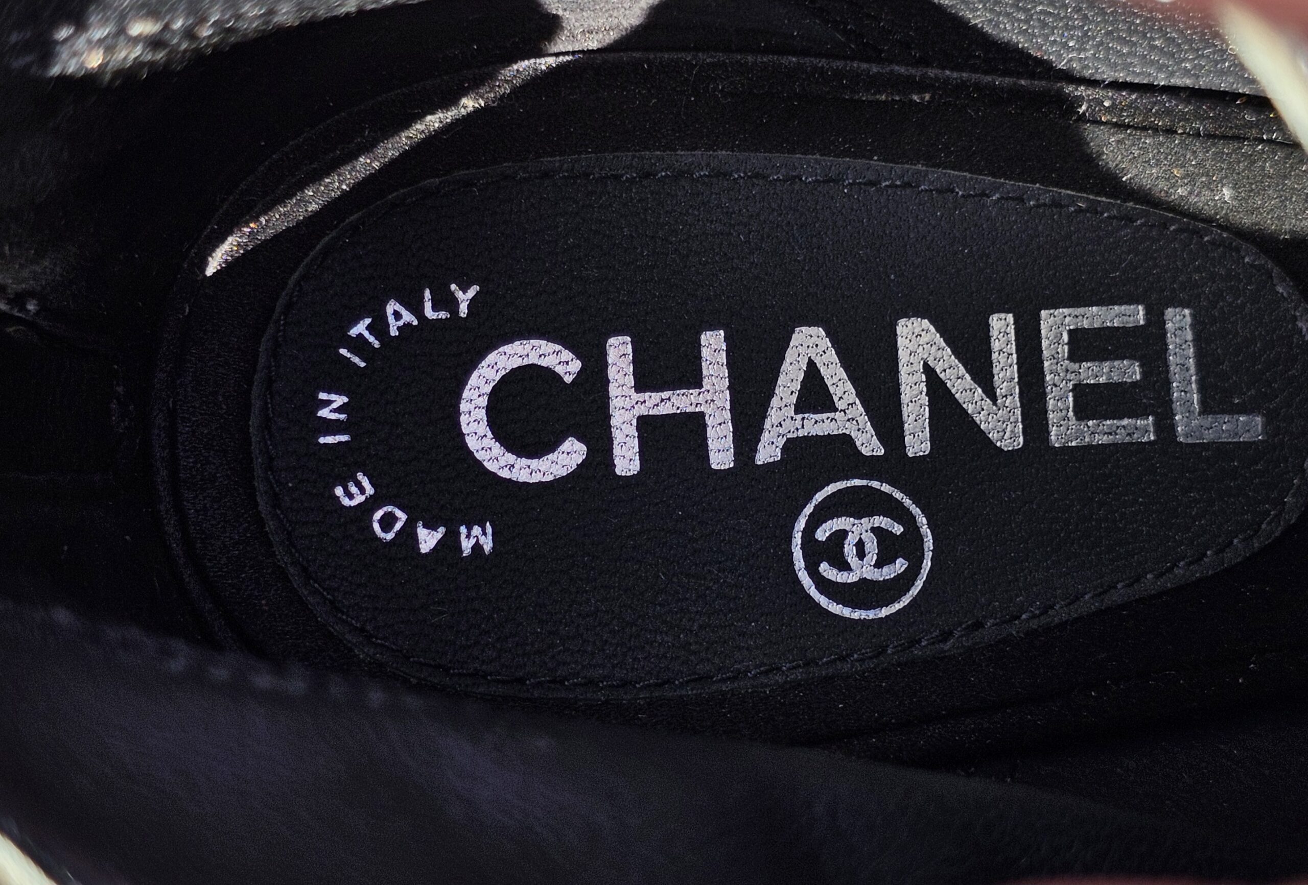Chanel made in Italy label on the insole of the lace peep toe ankle booties