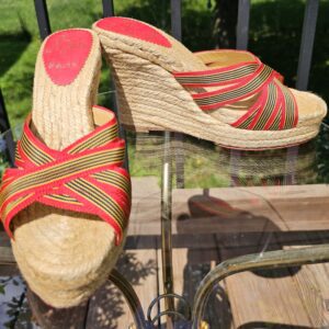 Christian Louboutin espadrille wedge sandals with red, navy and yellow striped crossover straps on a natural jute wedge