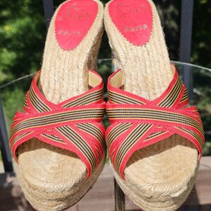 Top view of both Christian Louboutin espadrille wedge sandals showing the crossover straps and red signature footbeds