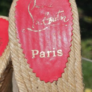 Red footbed of the Christian Louboutin espadrille wedge sandals stamped Christian Louboutin Paris