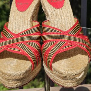 Front view of the Christian Louboutin espadrille wedge sandals showing the open toe and jute platform