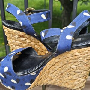 Louis Vuitton printed raffia wedge sandals from the side showing the approximately 5 inch raffia wedge heel