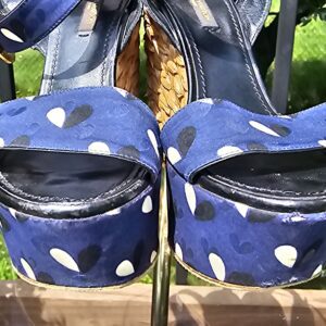 Front view of the Louis Vuitton printed raffia wedge sandals showing the open toe and platform