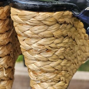 Close-up of the woven raffia wedge on the Louis Vuitton printed sandals showing wear and loose fibers