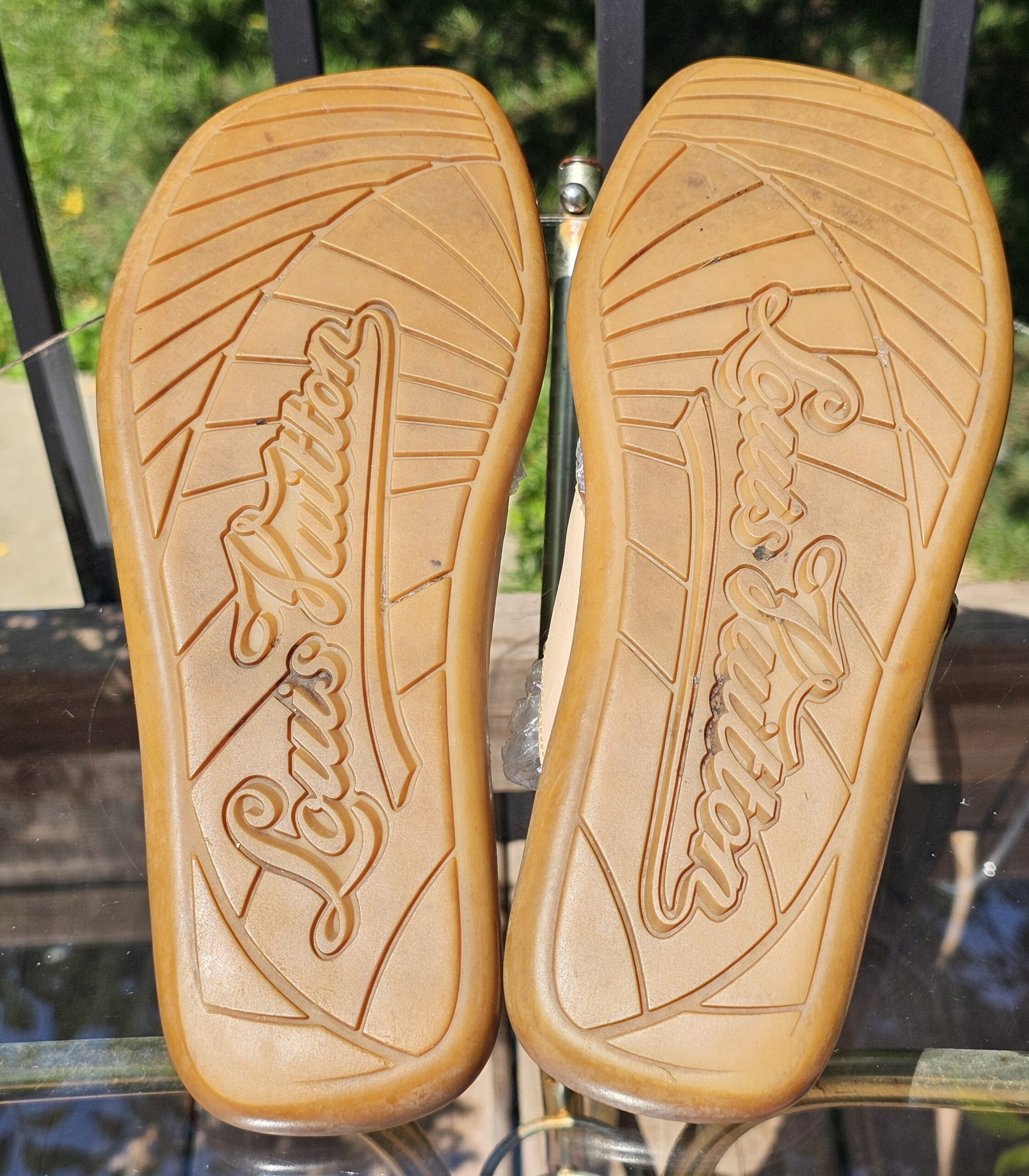 Leather soles of the Louis Vuitton Monogram denim thong sandals embossed Louis Vuitton