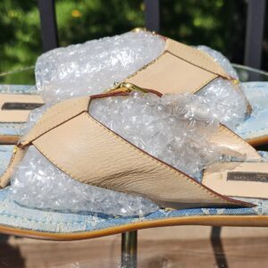 Side view of the Louis Vuitton Monogram denim thong sandals showing the flat denim footbed