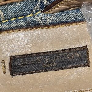 Louis Vuitton Paris label stitched onto the denim footbed of the thong sandals