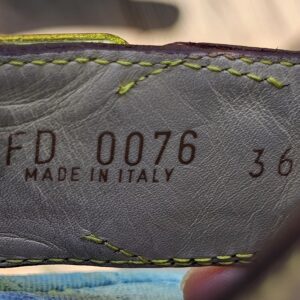 Stamp reading FD 0076 Made in Italy 36 and a half inside the Louis Vuitton Monogram denim thong sandals