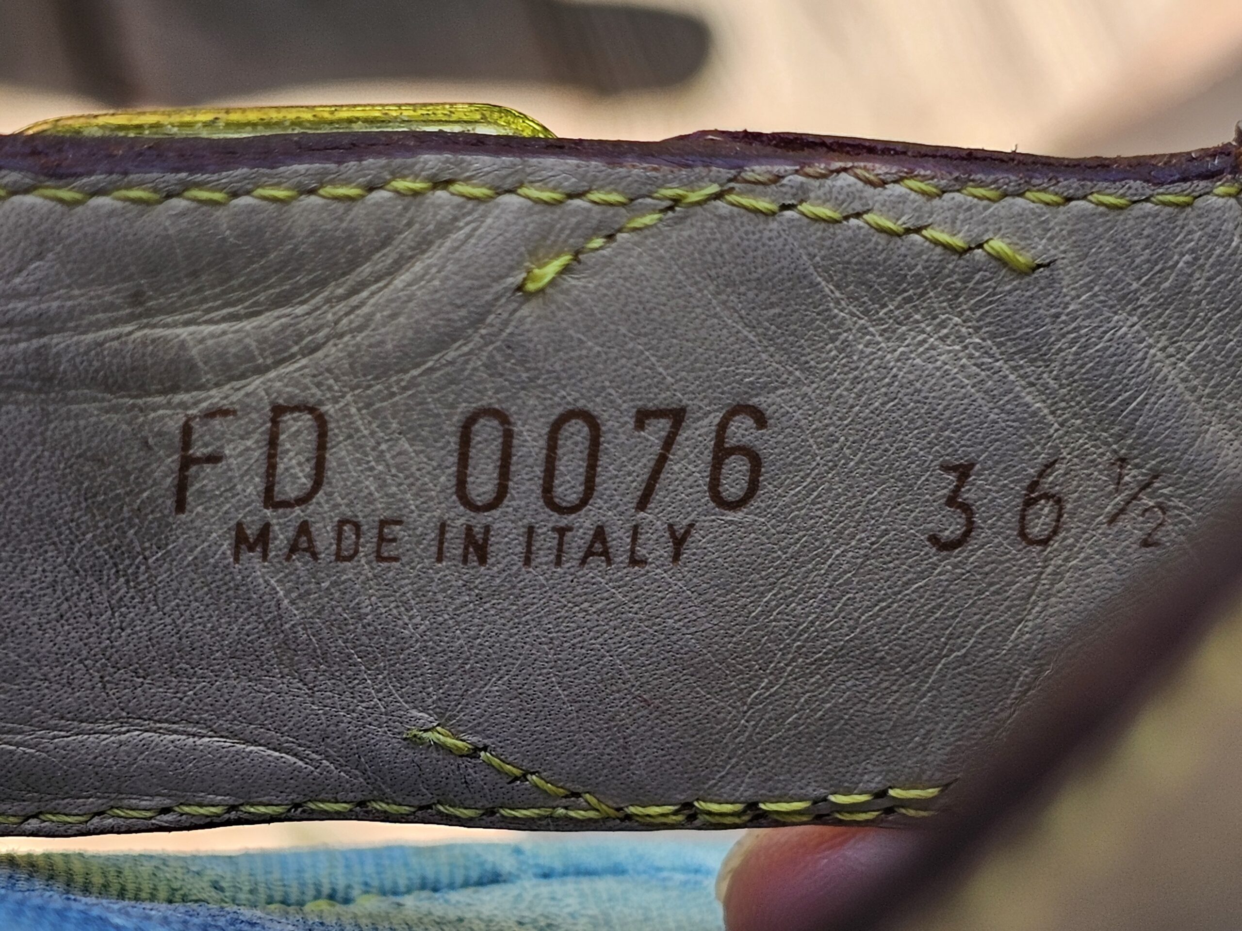 Stamp reading FD 0076 Made in Italy 36 and a half inside the Louis Vuitton Monogram denim thong sandals