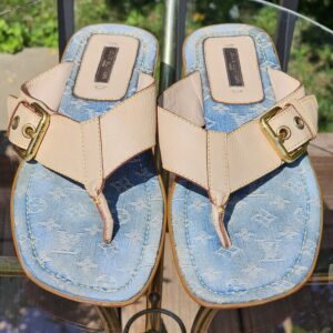 Pair of Louis Vuitton Monogram denim thong sandals photographed from above showing both footbeds