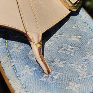 Close-up of the light blue Monogram denim footbed and leather toe post on the Louis Vuitton thong sandals