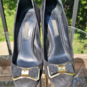 Top view of both Louis Vuitton crystal embellished bow suede pumps showing the peep toes and bow detail