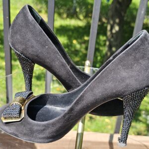 Angled view of the Louis Vuitton crystal embellished bow suede pumps with the crystal heel in profile