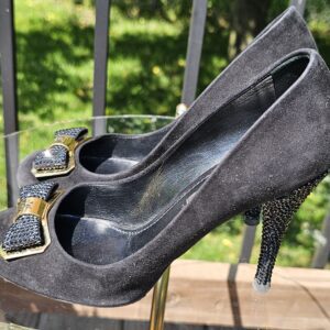 Suede uppers of the Louis Vuitton crystal bow pumps shown for condition with rubbing and marks from use