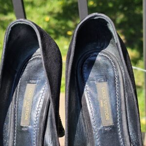 Louis Vuitton stamped insoles inside the crystal embellished bow suede pumps