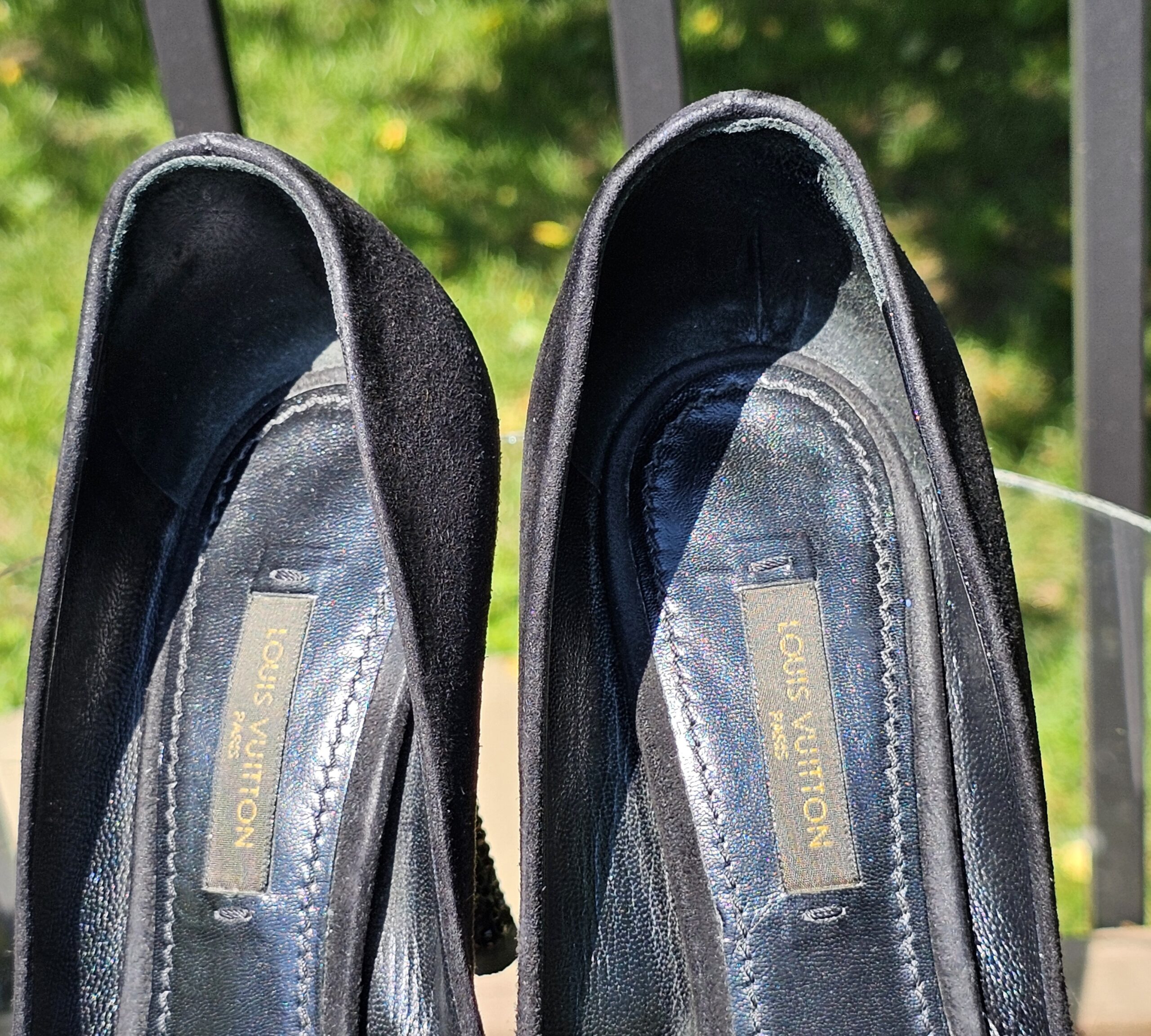 Louis Vuitton stamped insoles inside the crystal embellished bow suede pumps