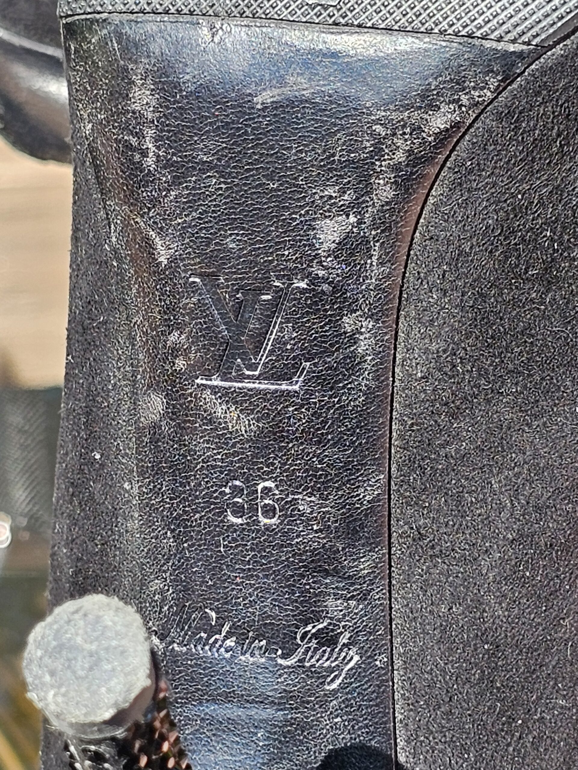 LV logo, size 36 and Made in Italy stamped on the sole of the Louis Vuitton crystal bow suede pumps
