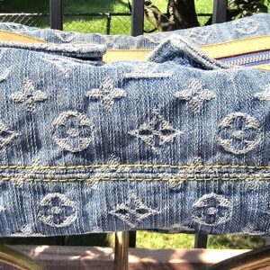 Base of the Louis Vuitton Monogram Denim Baggy PM shown for condition