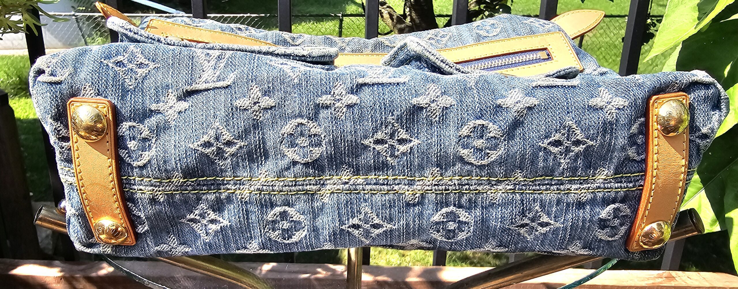 Base of the Louis Vuitton Monogram Denim Baggy PM shown for condition