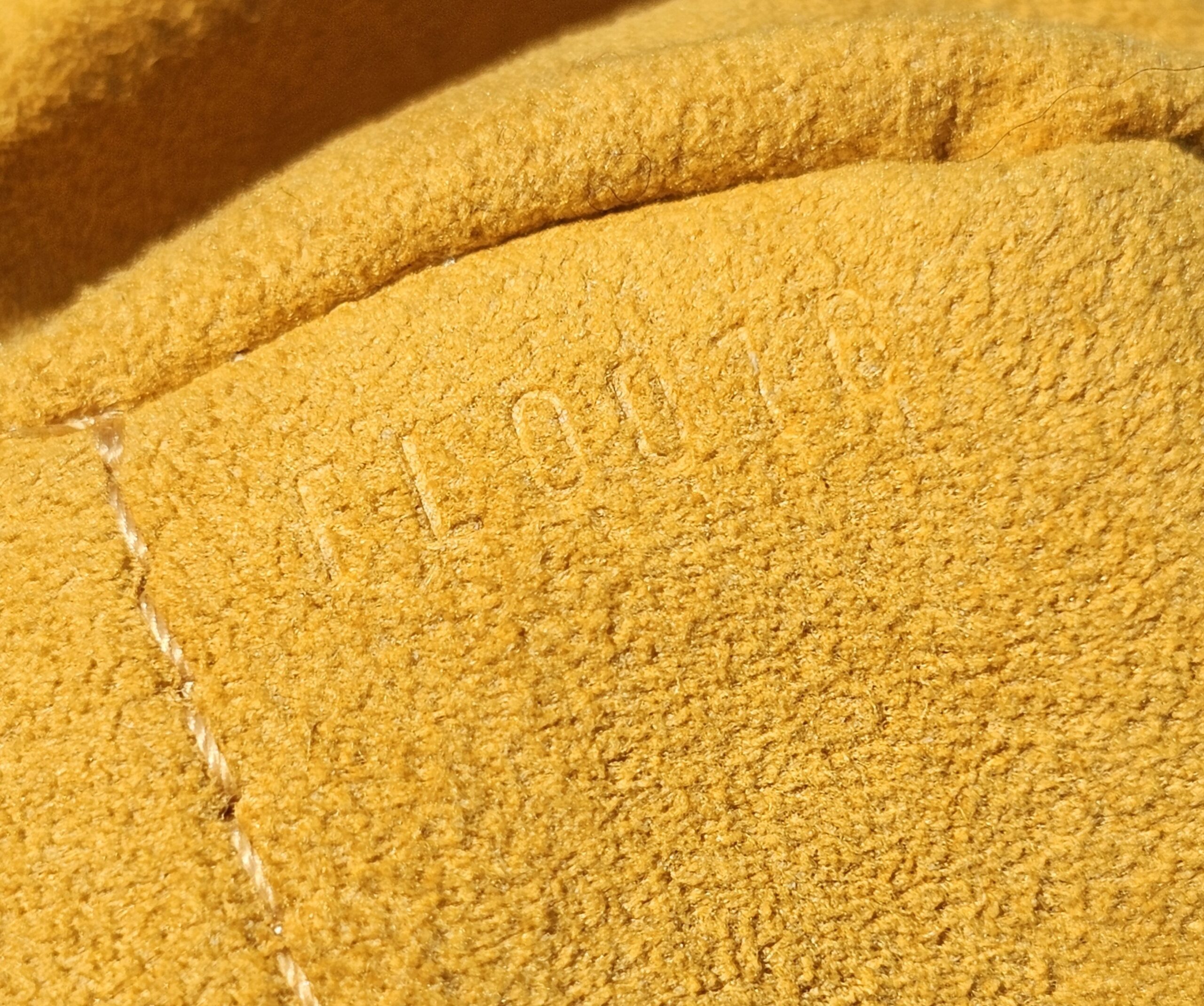 Date code FL0016 stamped inside the Louis Vuitton Monogram Denim Baggy PM