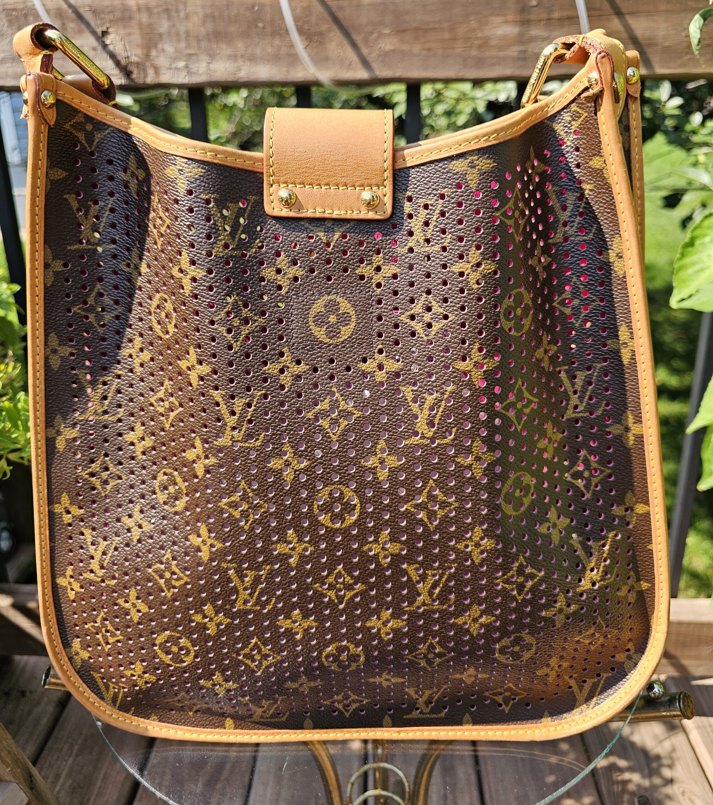Back of the Louis Vuitton Monogram Perforated Musette in unperforated Monogram coated canvas