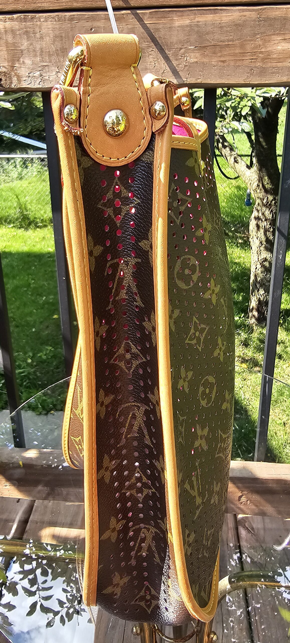 Slim side profile of the Louis Vuitton Monogram Perforated Musette with vachetta trim