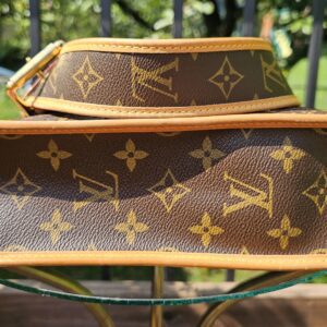 Base of the Louis Vuitton Monogram Perforated Musette in Monogram canvas with vachetta piping