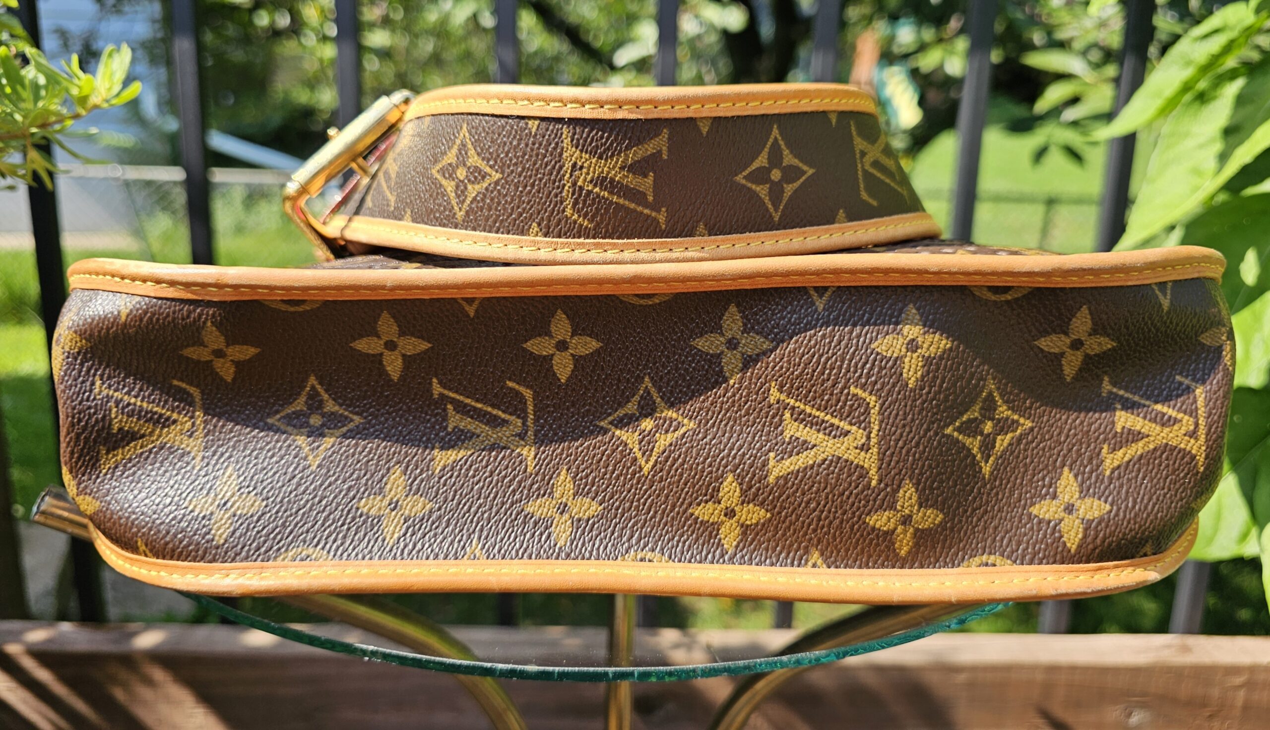 Base of the Louis Vuitton Monogram Perforated Musette in Monogram canvas with vachetta piping