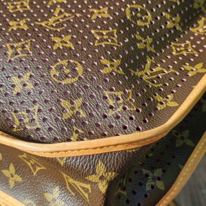Perforated Monogram canvas and natural vachetta piping on the Louis Vuitton Musette