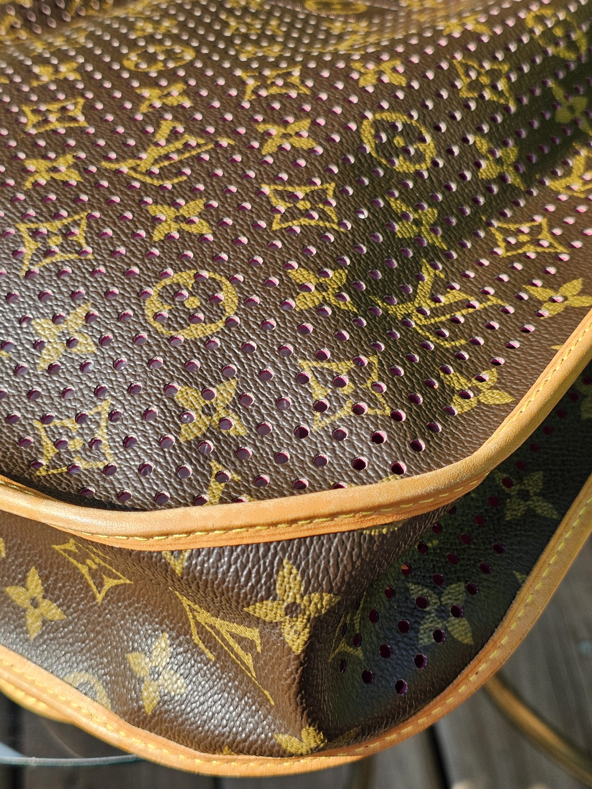 Perforated Monogram canvas and natural vachetta piping on the Louis Vuitton Musette