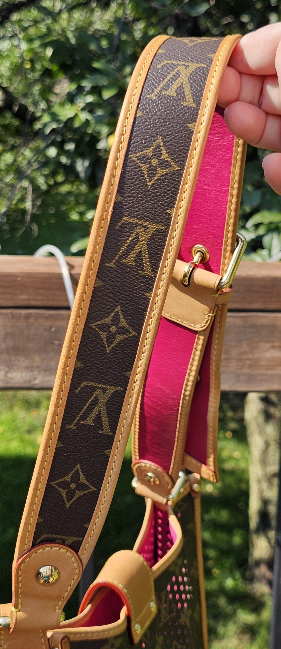 Adjustable Monogram canvas shoulder strap for the Louis Vuitton Perforated Musette held in hand
