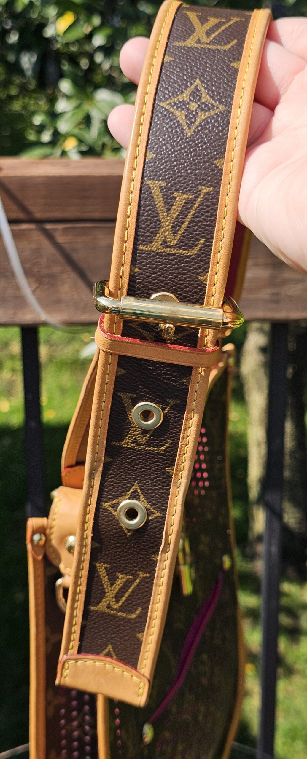 Buckle and adjustment holes on the Monogram strap of the Louis Vuitton Perforated Musette