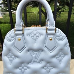 Back of the Louis Vuitton Bubblegram Alma BB showing the quilted Monogram pattern in Ice Blue calfskin
