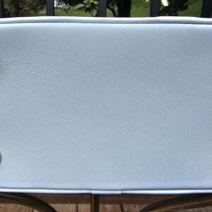 Base of the Louis Vuitton Bubblegram Alma BB showing the four protective gold metal feet