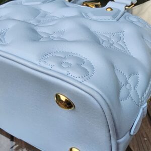 Corner of the Louis Vuitton Bubblegram Alma BB shown for condition
