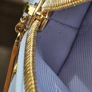 Gold-tone zip and Monogram textile interior of the Louis Vuitton Bubblegram Alma BB
