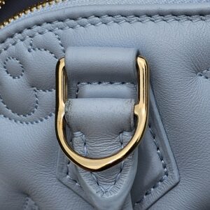 Gold-tone D-ring for the removable strap on the Louis Vuitton Bubblegram Alma BB