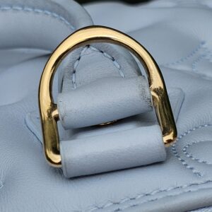 D-ring attachment area of the Louis Vuitton Bubblegram Alma BB showing light rubbing from use