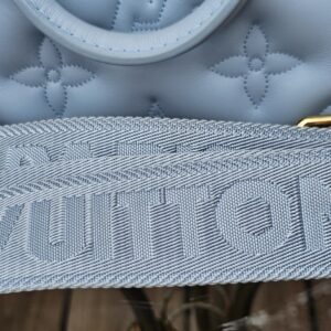 Louis Vuitton lettering woven into the jacquard strap of the Bubblegram Alma BB